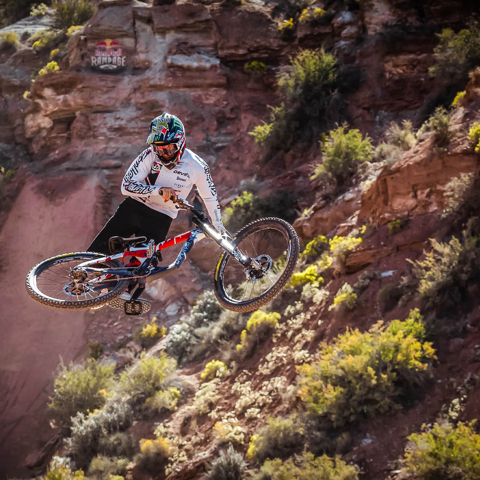 Mountain bike rider jumping in the desert, wearing new Troy Lee Designs bike gear