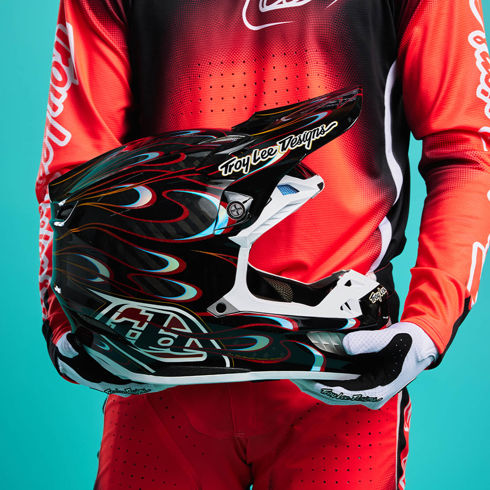 Moto Rider Holding a Troy Lee Designs SE5 helmet 